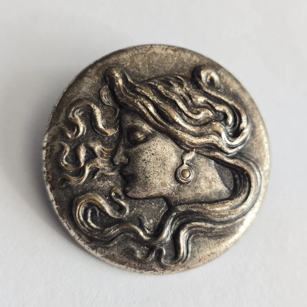 Art Nouveau style brooch woman with flowing hair dark silver tone pin
